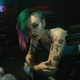 Cyberpunk 2077's Judy leans over her ripper equipment before operating.